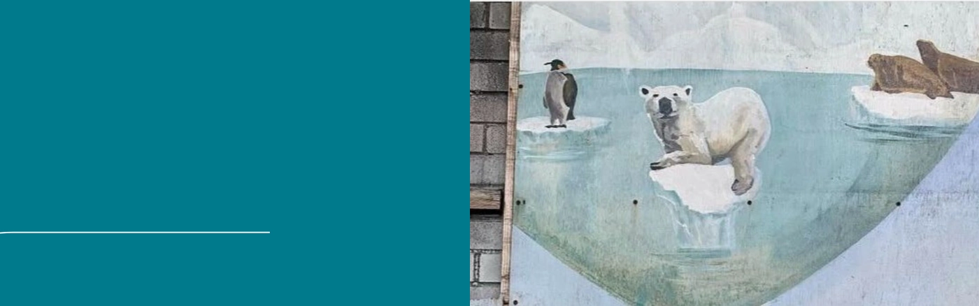 Seinämaalaus jääkarhusta hupenevalla jäälautalla.