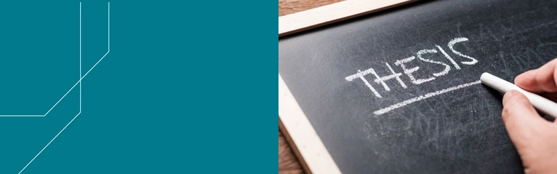 Liitutauluun kirjoitettu sana "thesis".